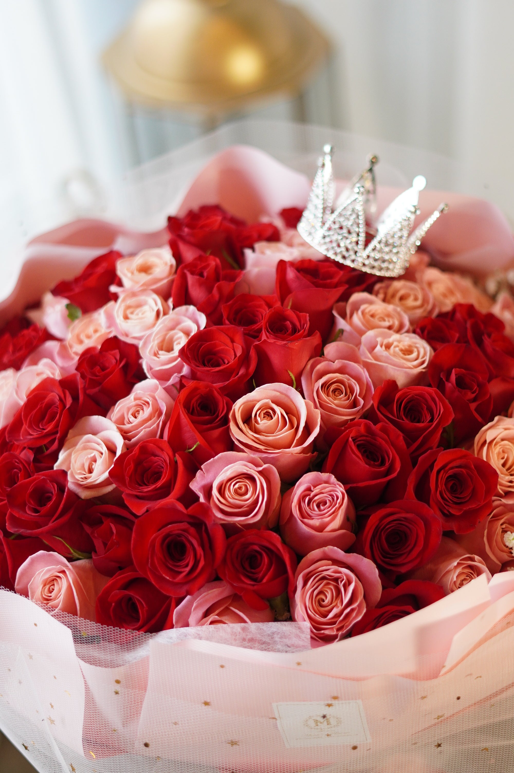 Custom 100 red and pink roses bouquet with crystal crown topper — Moon's Flowers Toronto