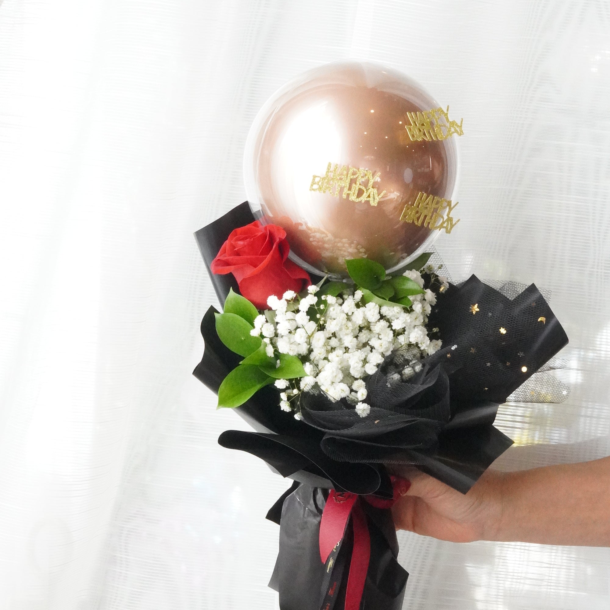 Bubble Rose Bouquet with white baby’s breath, fresh roses, greenery and “Happy Birthday” balloon by Moon’s Flowers