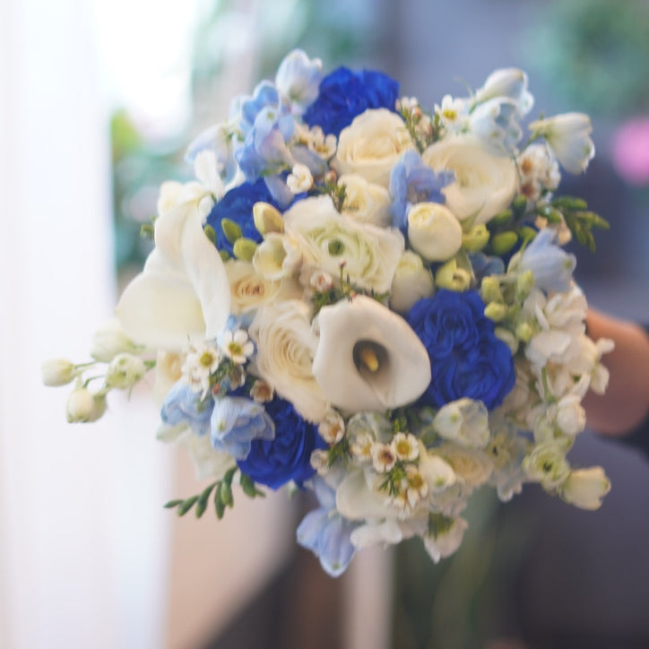 blue wedding bouquet with white roses calla lilies elegant bridal flowers