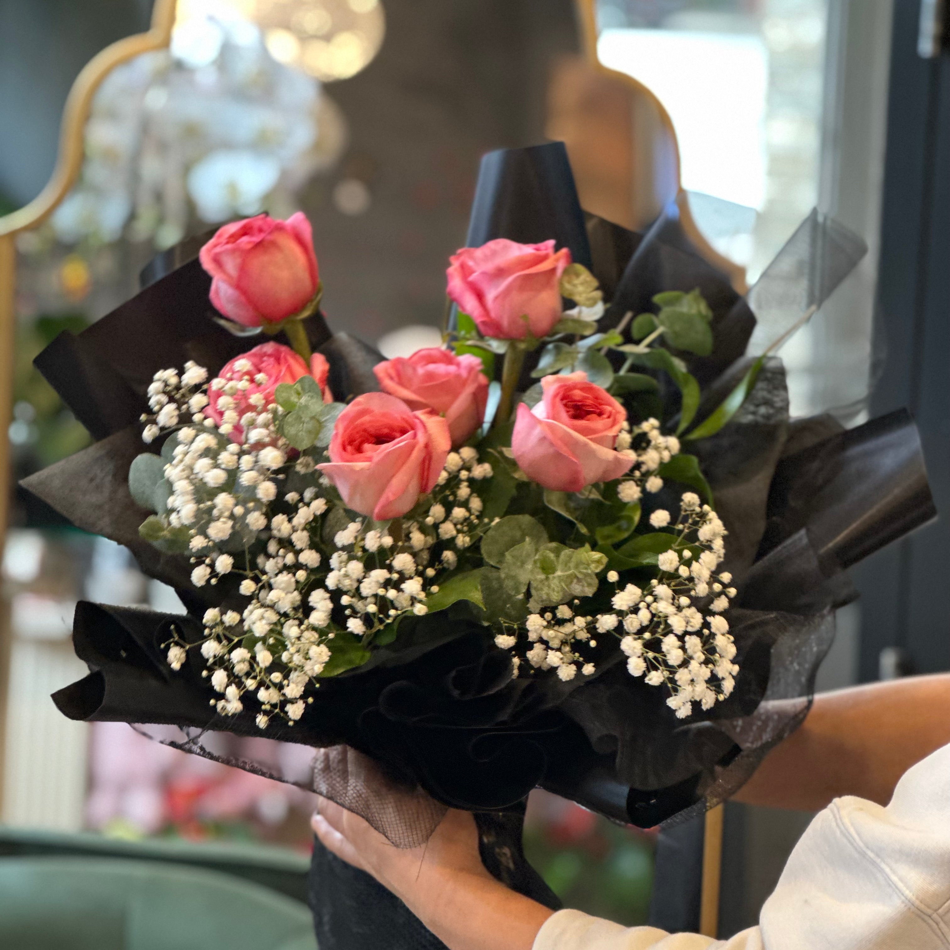 Half dozen pink rose bouquet styled for a simple and thoughtful gift