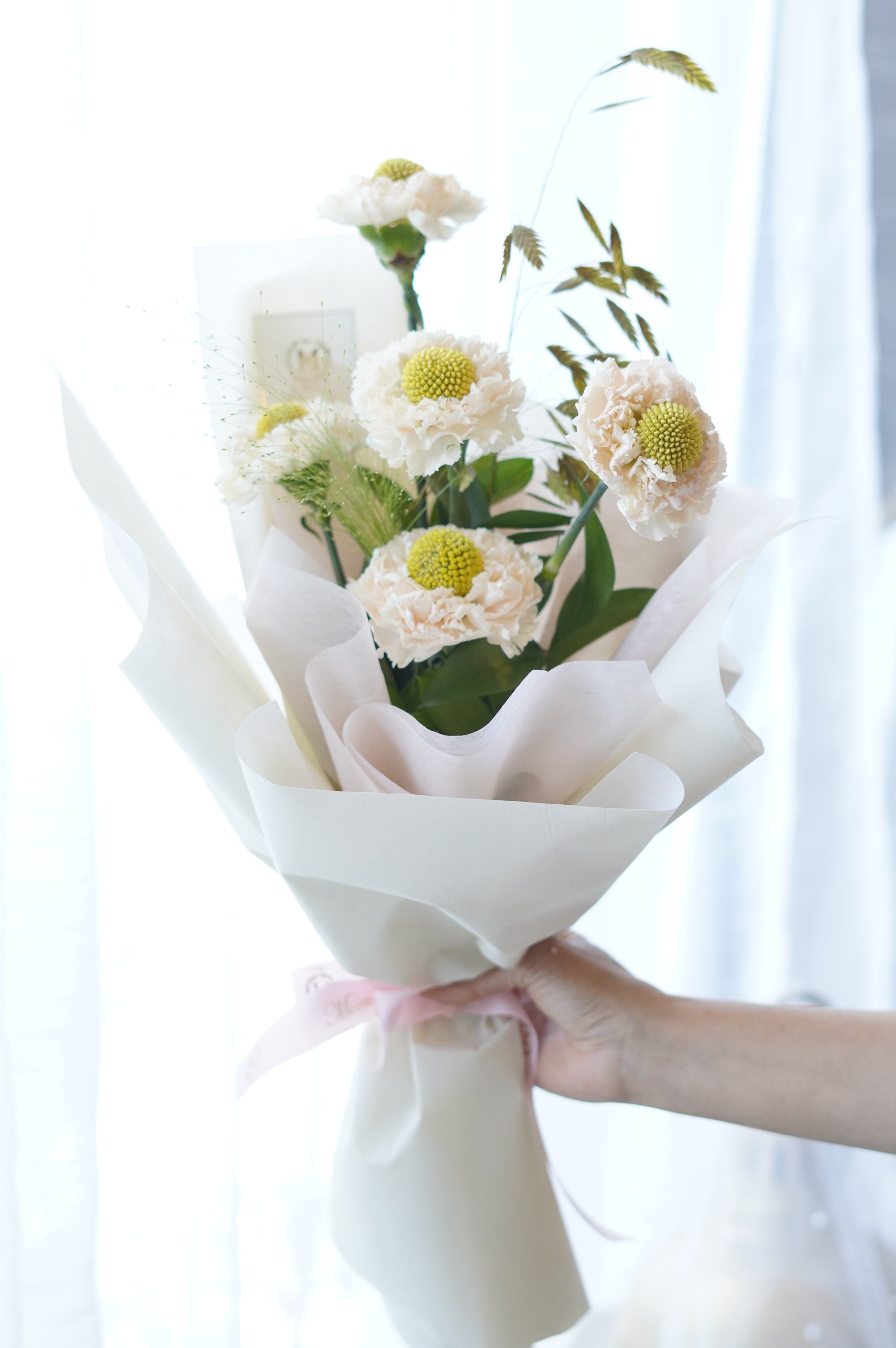 Ivory Dream Carnation Bouquet – blush white carnations with green button centres, wrapped in matte white paper, Toronto florist
