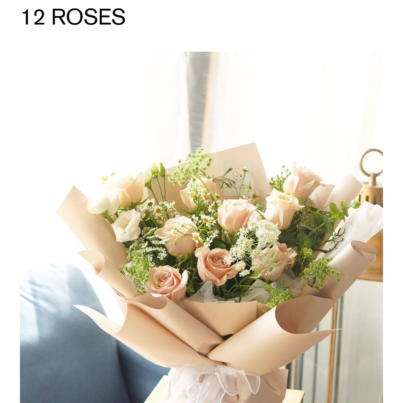 A luxurious hand-tied bouquet featuring elegant Champagne roses, lush white lisianthus, and chamomile perfect for a premium Mother's Day gift