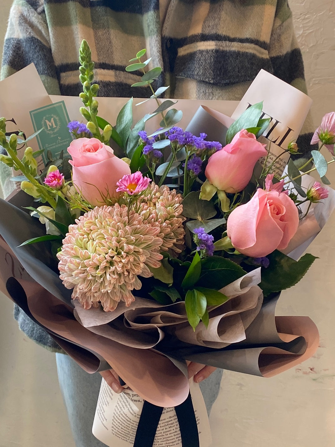 Close-up detail of fresh pink and violet floral arrangement by Moon's Flowers Toronto florist.