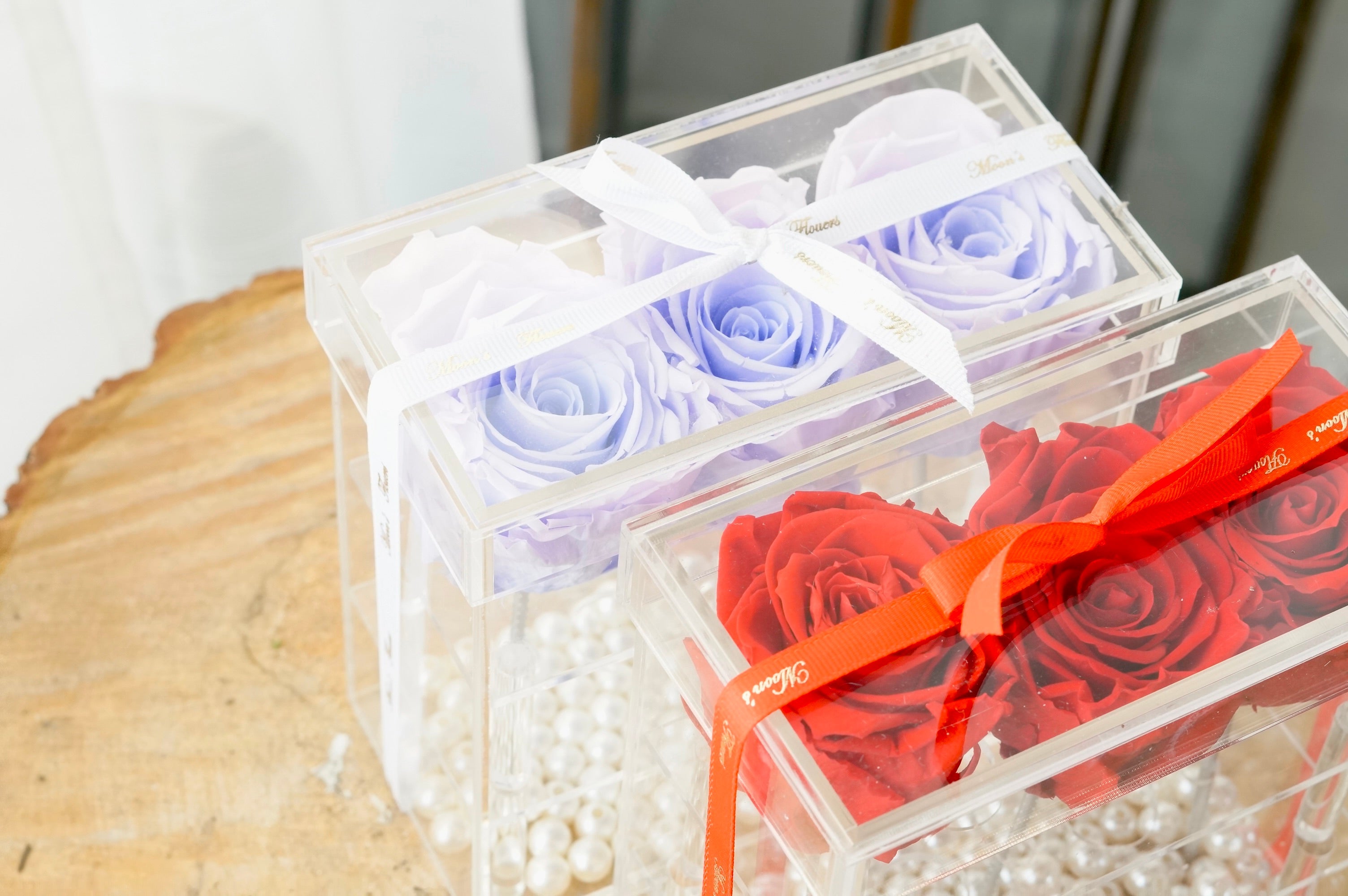 Close up to show the intricacy of the preserved roses, found in red and lilac