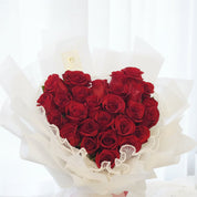 Close up image of the fresh cut roses used in the Heart Rose Box. It is in the classic red colour and contains 27 roses, a few more than the typical 2 dozen