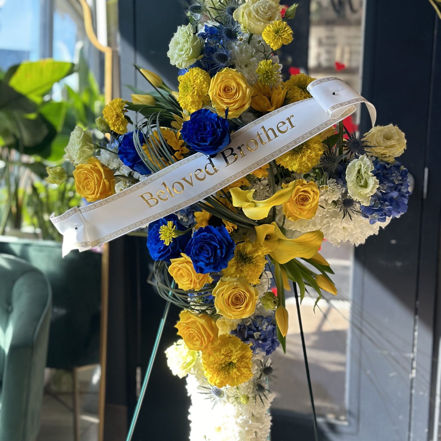 Blue flowers include roses, thistle, and hydrangeas. Yellow Flowers may include roses, tulips, carnations and calla lilies.