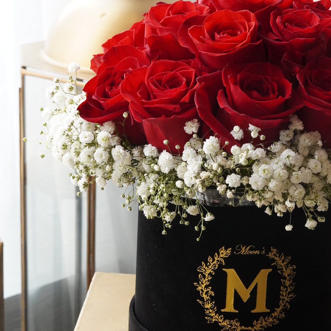 15 rose box arrangement with baby’s breath styled in Moon’s Flowers’ signature box