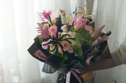 Pink Horizon in blush-and-black bouquet wrapping — Toronto graduation flower delivery