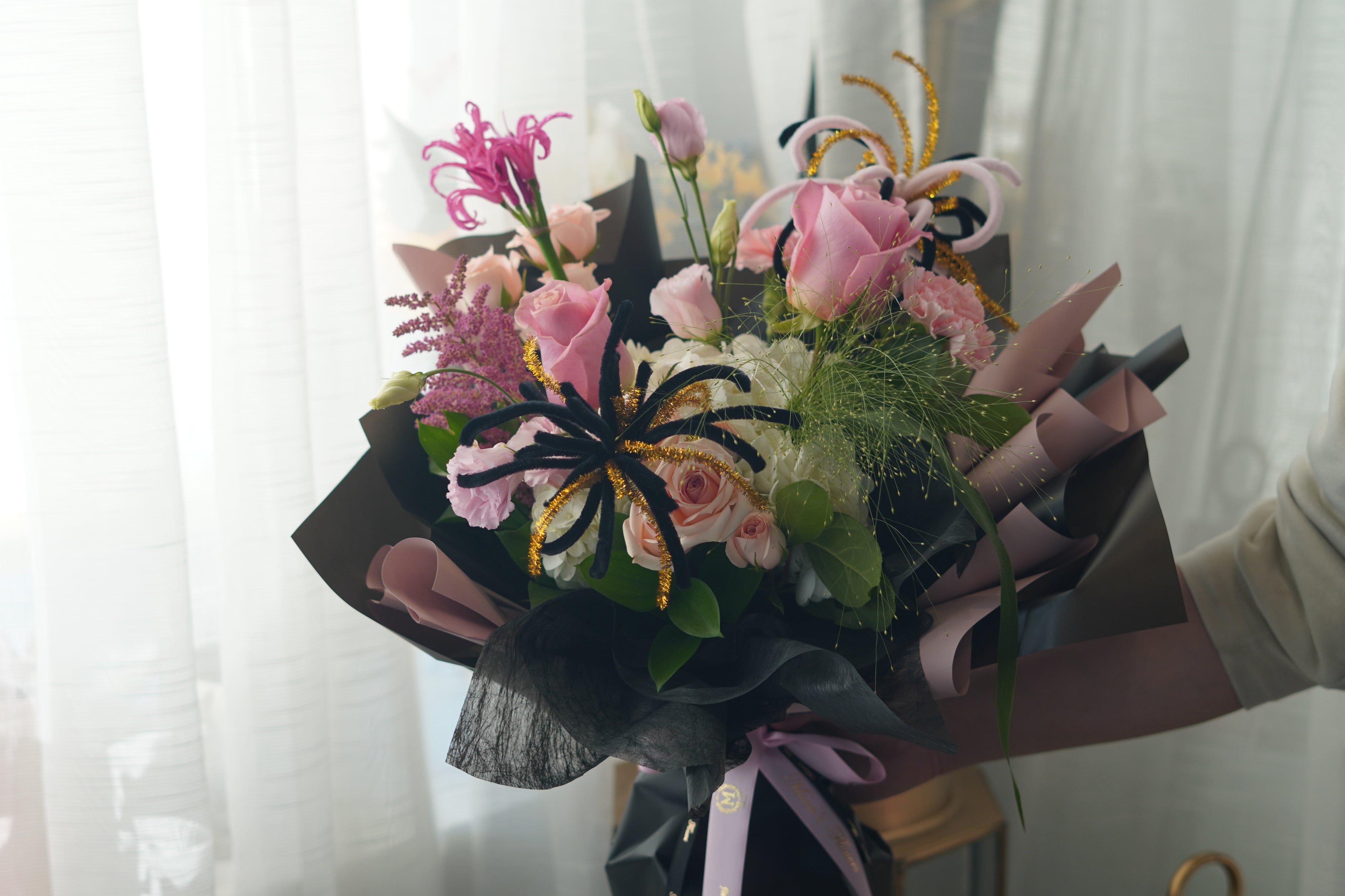 Pink Horizon in blush-and-black bouquet wrapping — Toronto graduation flower delivery