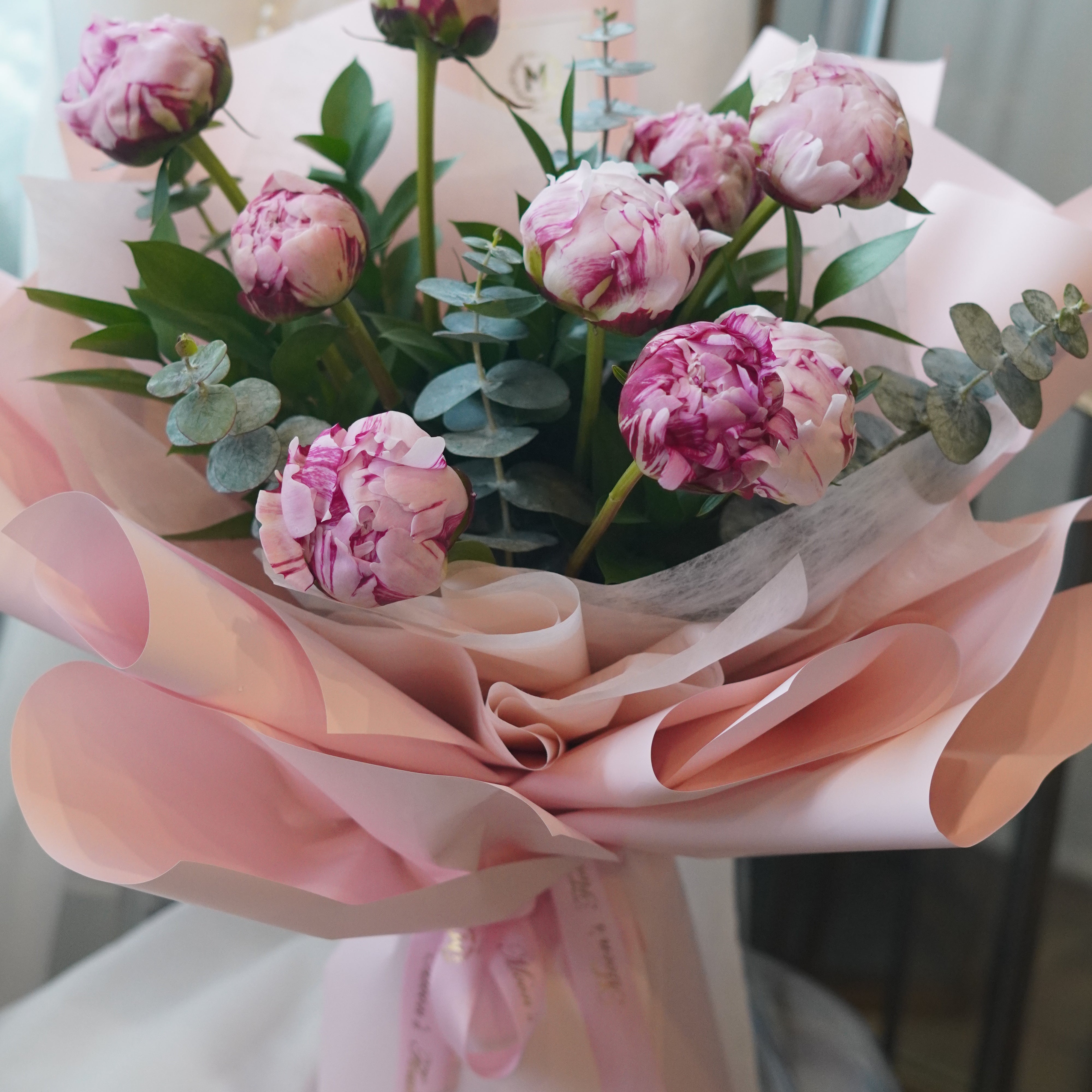 pink peony bouquet wrapped in soft pink paper toronto