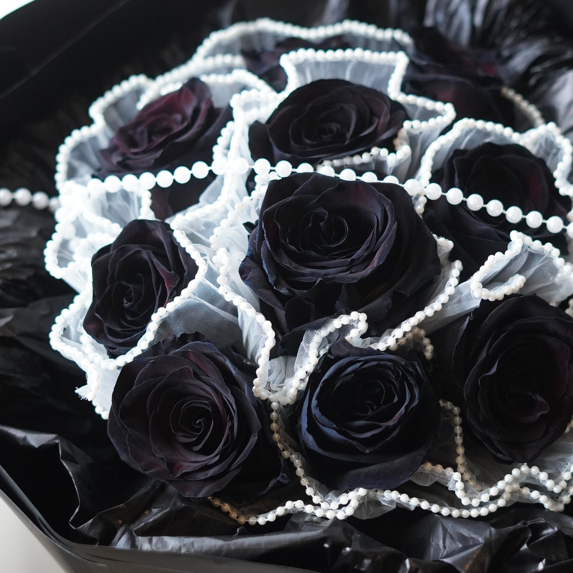 close - up 10 black rose bouquet with black warrping