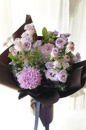 Elegant lavender and violet hand-tied bouquet with premium purple flowers and Korean-style wrapping by Moon’s Flowers