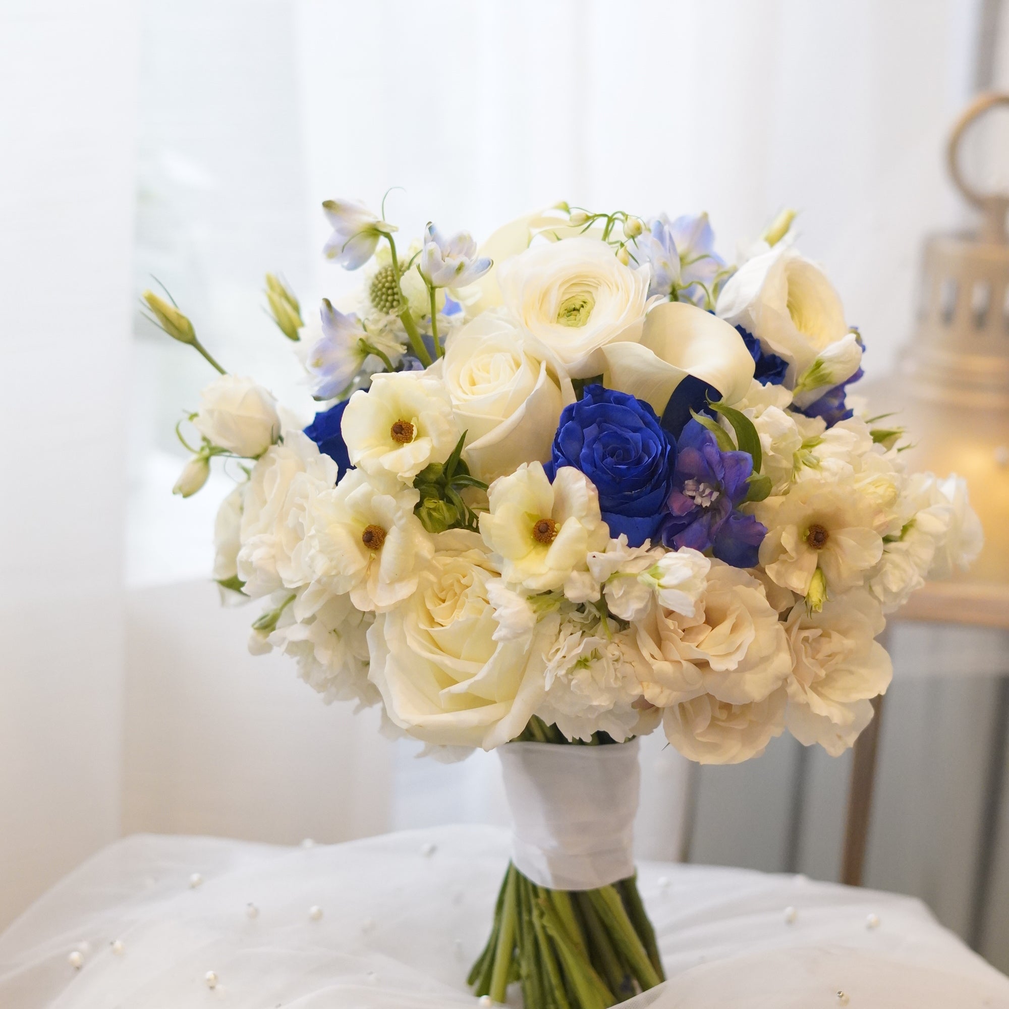 Blue and white flower bouquet with white roses and seasonal flowers, Toronto florist