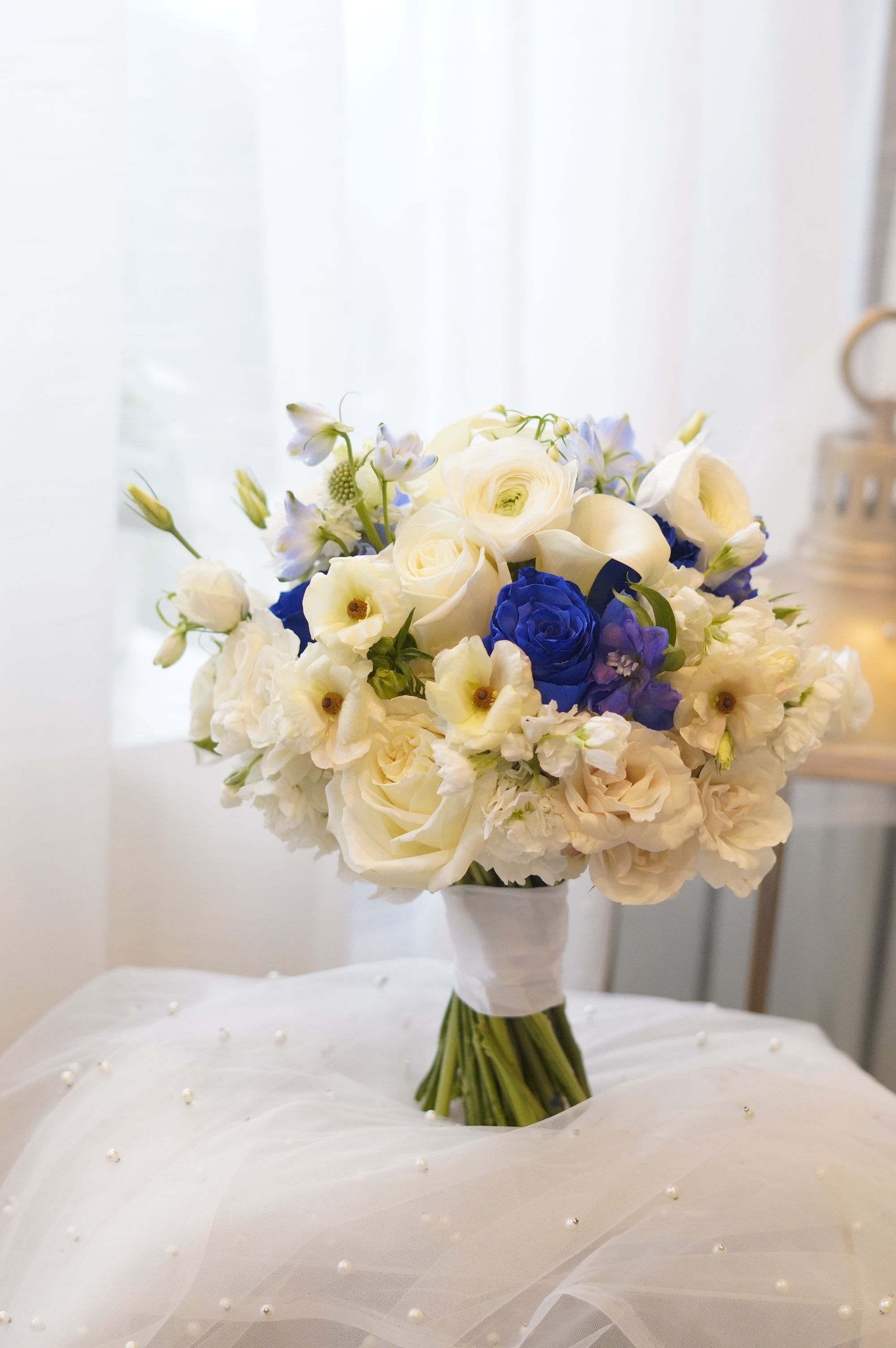 Blue and white flower bouquet with white roses and seasonal flowers, Toronto florist