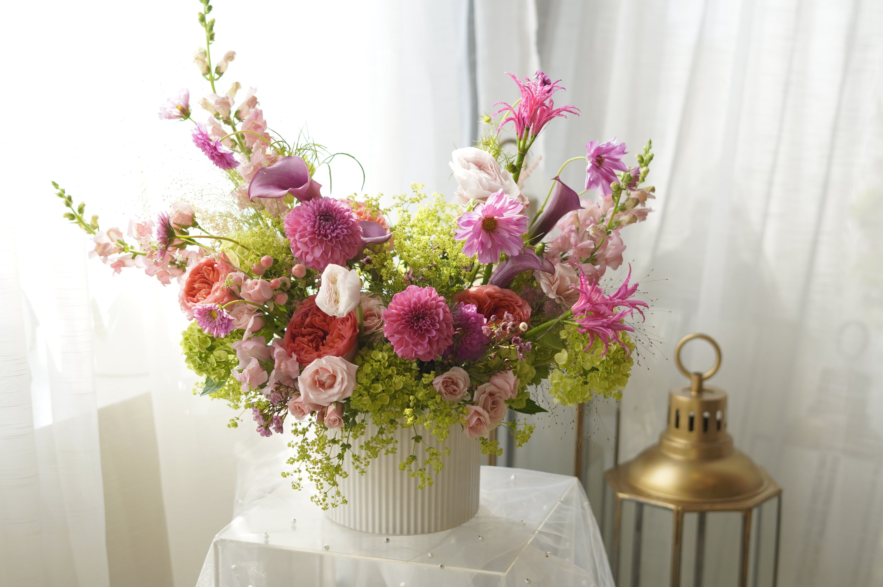 Pink dahlias and coral garden roses in lush garden-style arrangement — Toronto florist Moon's Flowers