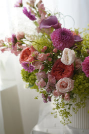 Pink dahlias and coral garden roses in lush garden-style arrangement — Toronto florist Moon's Flowers