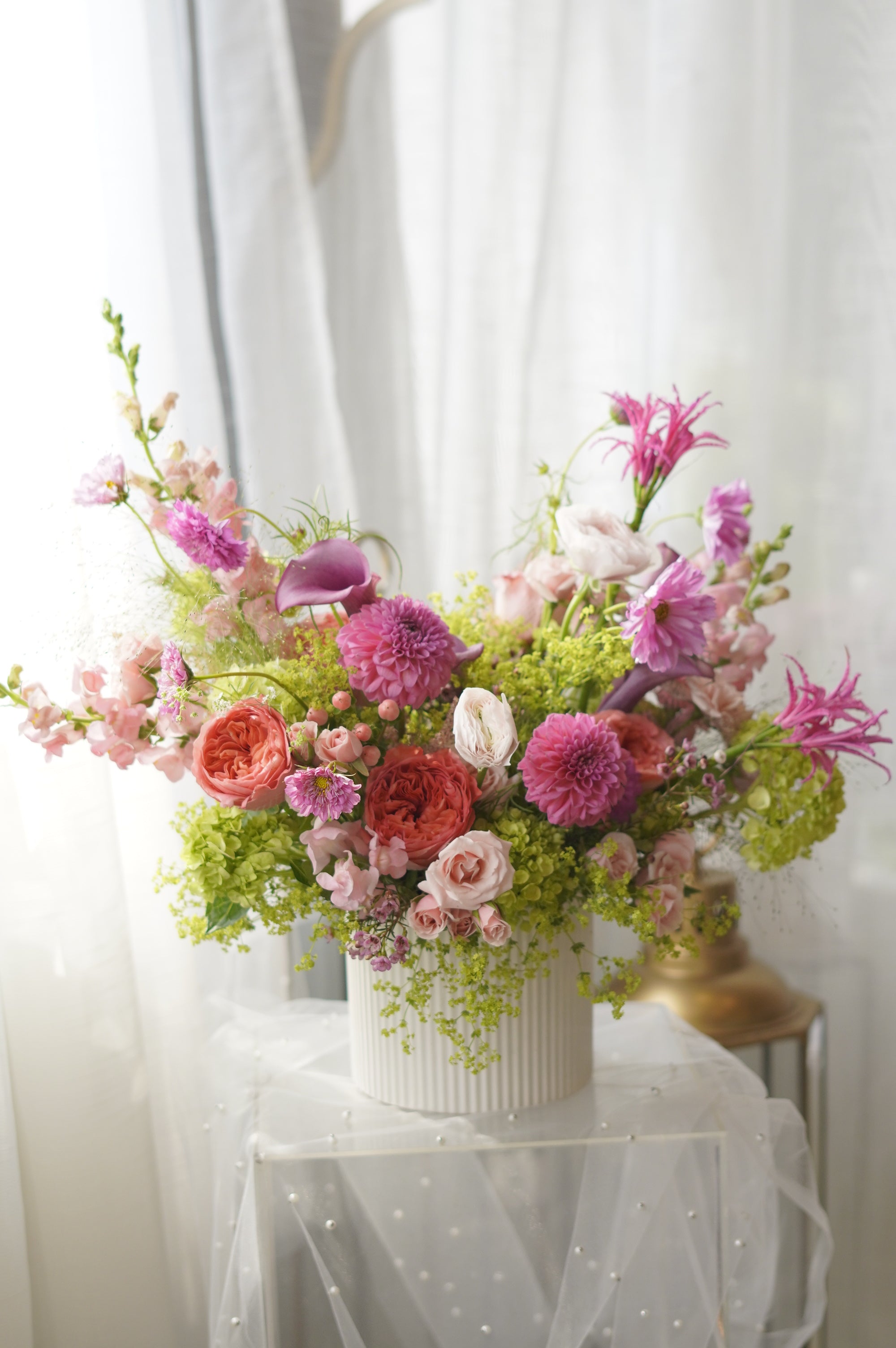 Pink dahlias and coral garden roses in lush garden-style arrangement — Toronto florist Moon's Flowers