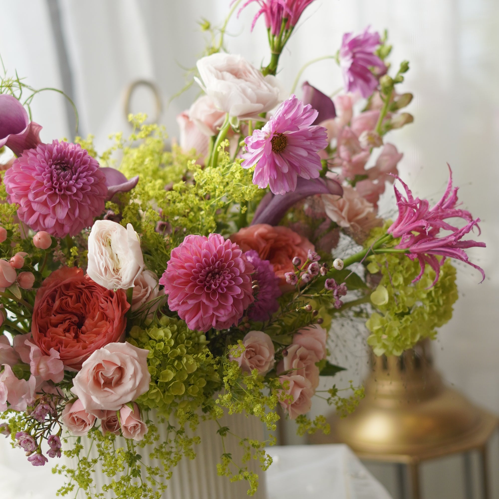 Pink dahlias and coral garden roses in lush garden-style arrangement — Toronto florist Moon's Flowers