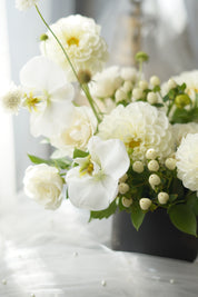 Ivory Dahlia Garden Arrangement in black ribbed vase — same-day flower delivery Toronto