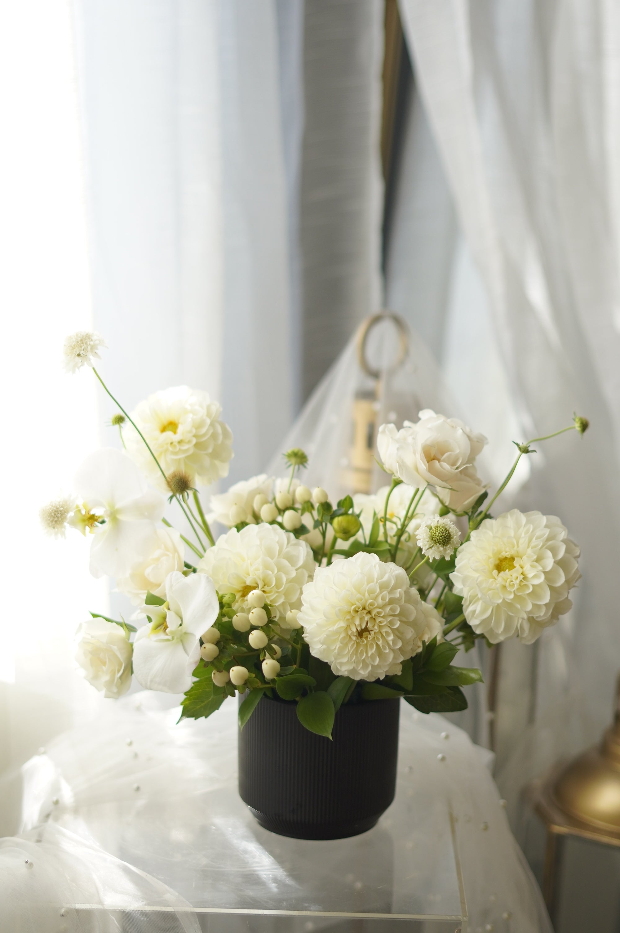 Ivory Dahlia Garden Arrangement in black ribbed vase — same-day flower delivery Toronto