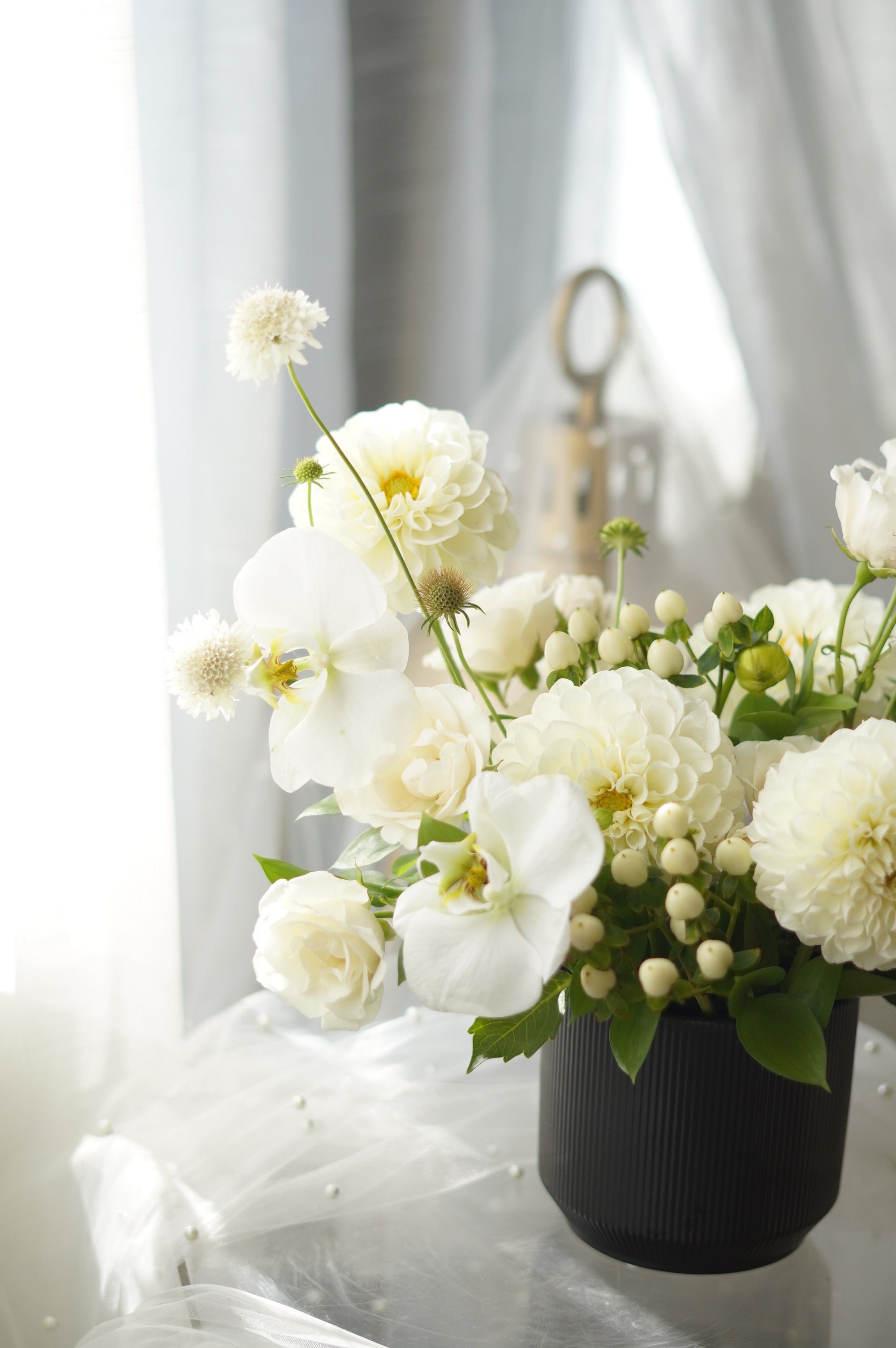 Ivory Dahlia Garden Arrangement in black ribbed vase — same-day flower delivery Toronto