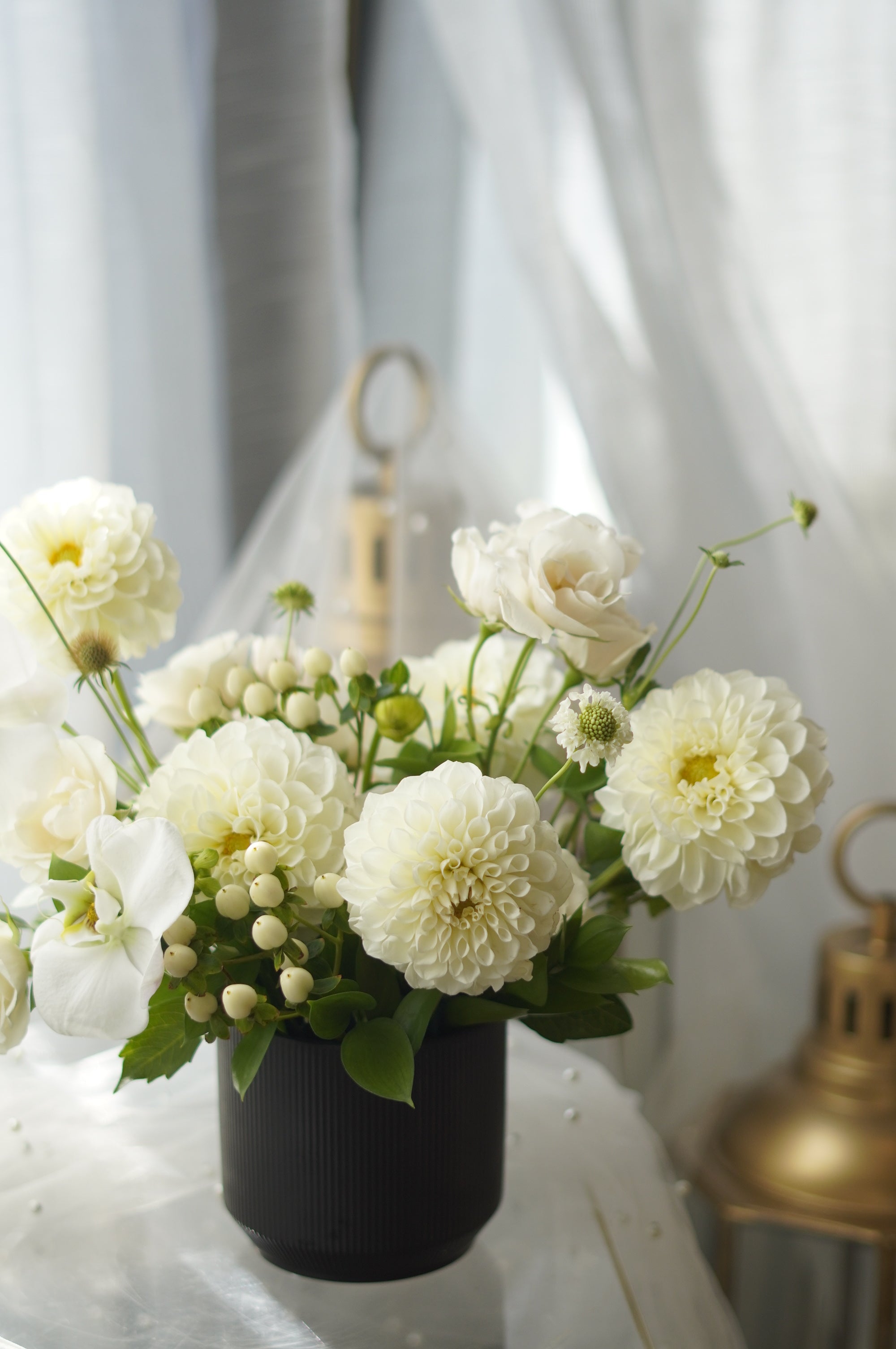 Ivory Dahlia Garden Arrangement in black ribbed vase — same-day flower delivery Toronto