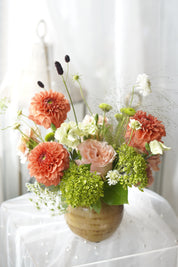 Lush orange dahlia floral arrangement with blush rose and green viburnum — GTA florist same-day delivery

