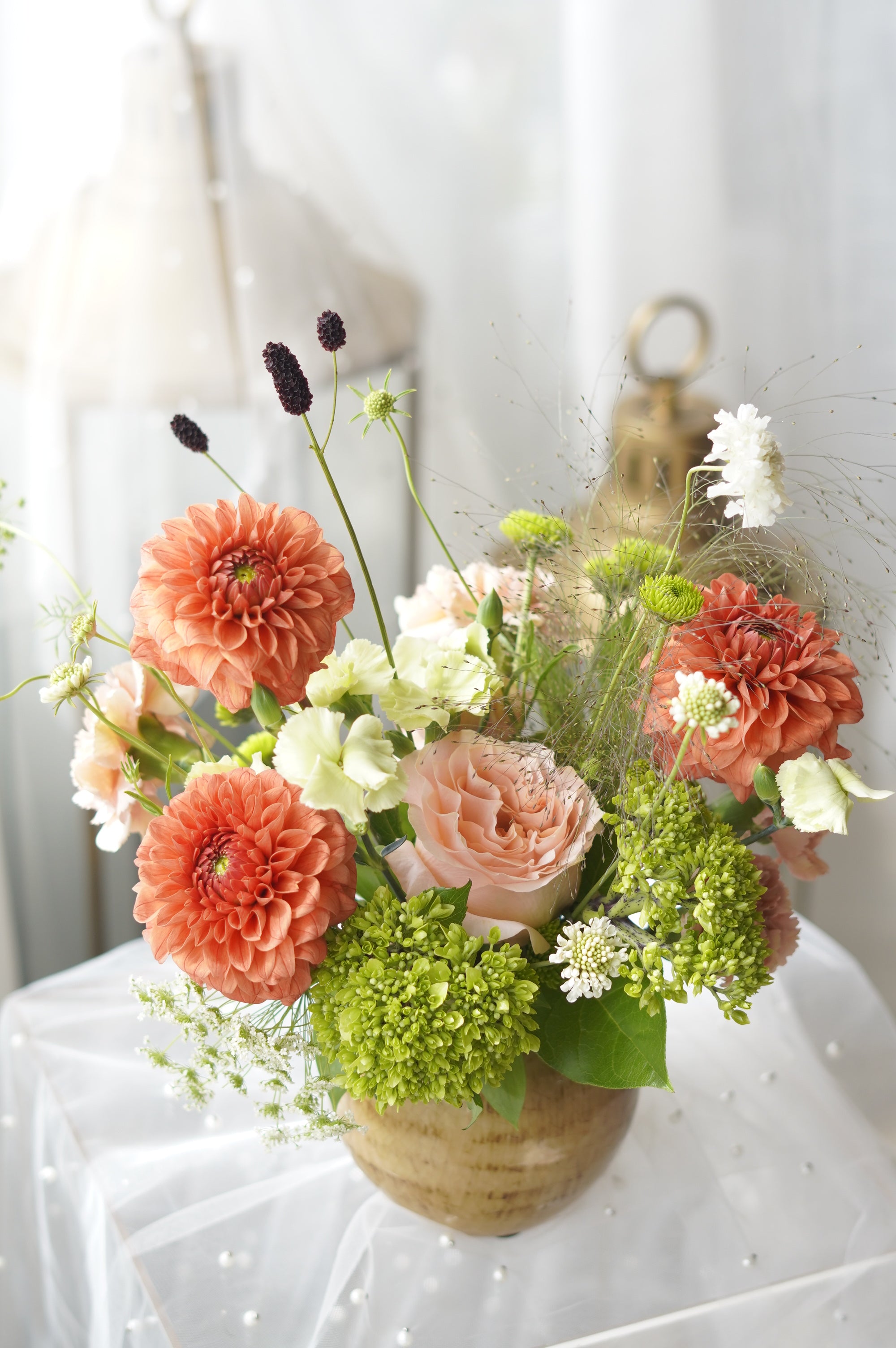Coral Dusk dahlia and garden rose arrangement in rustic gold ceramic vase — Toronto flower delivery