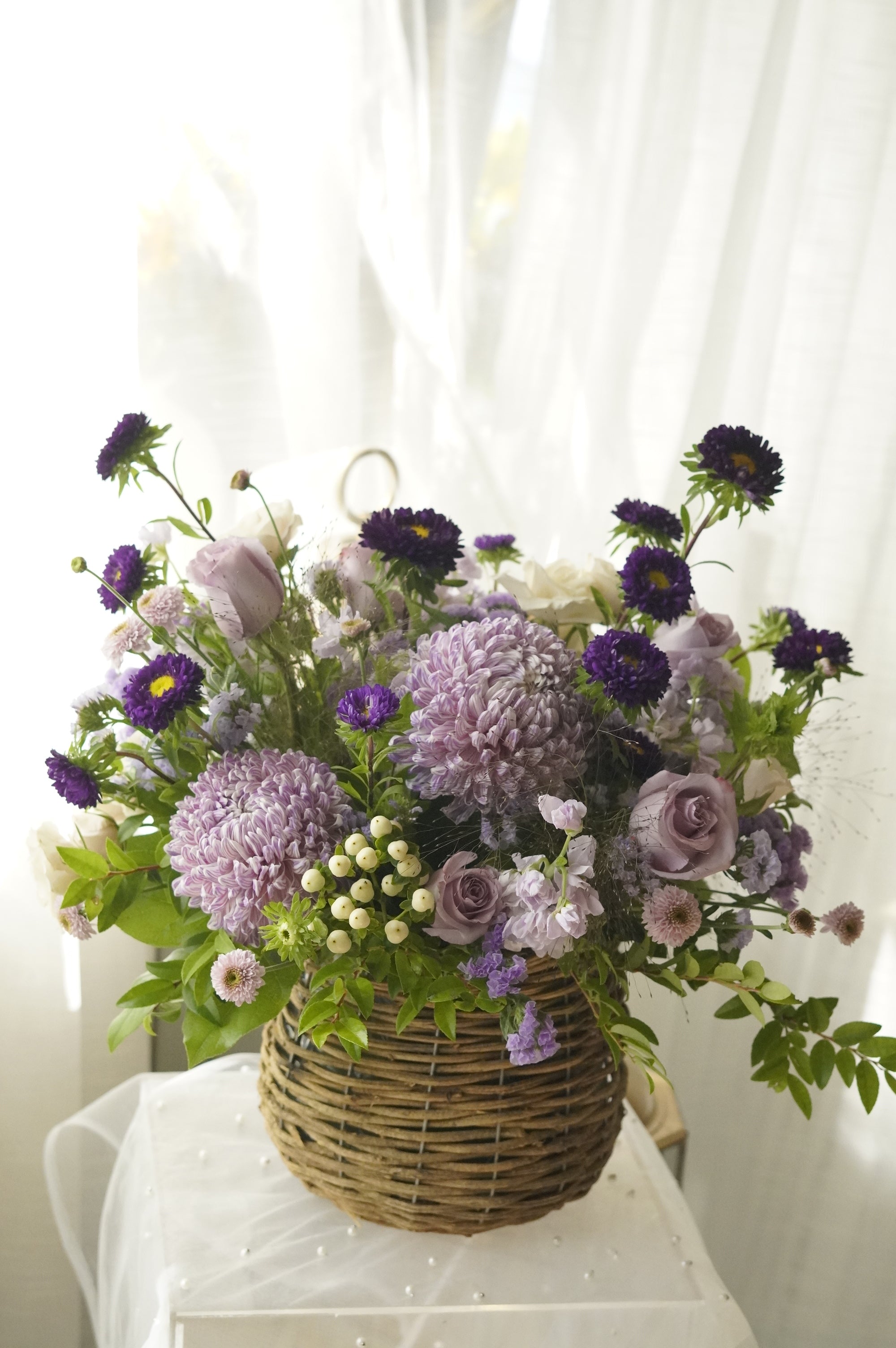 Lavender Muse arrangement in woven basket — Toronto flower delivery
