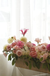 Low blush and ivory floral centrepiece with cascading greenery