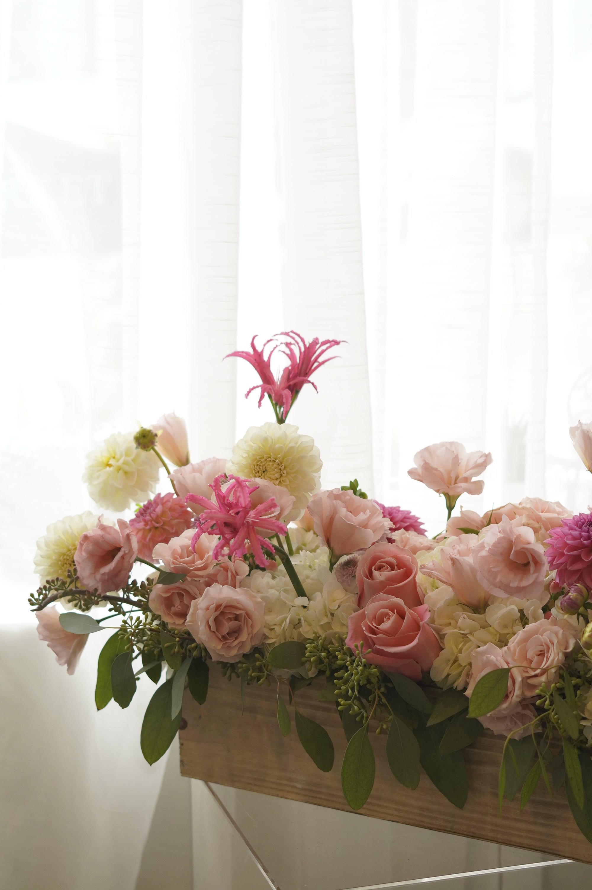 Low blush and ivory floral centrepiece with cascading greenery