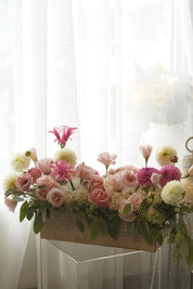Pink roses, dahlias, hydrangea, and lisianthus garden arrangement