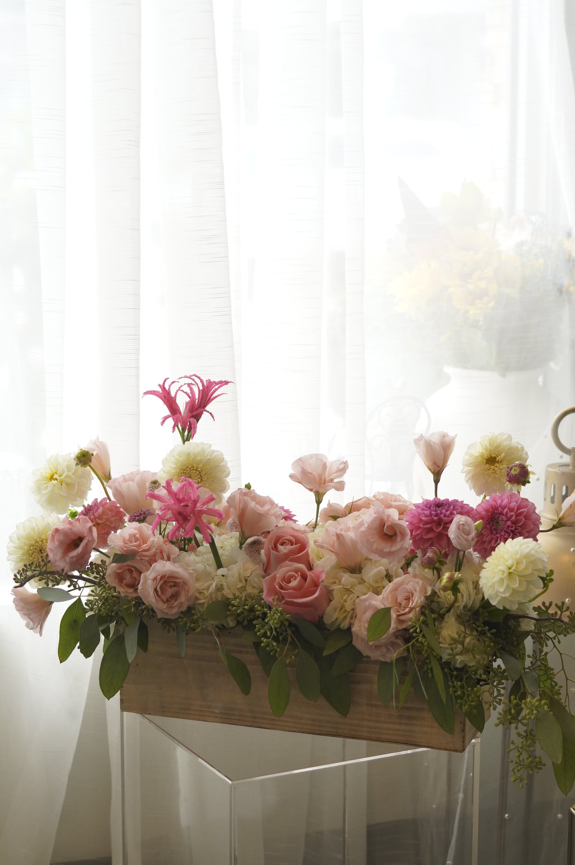 Pink roses, dahlias, hydrangea, and lisianthus garden arrangement