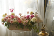 Luxury blush garden flowers arranged in a rustic wooden box
