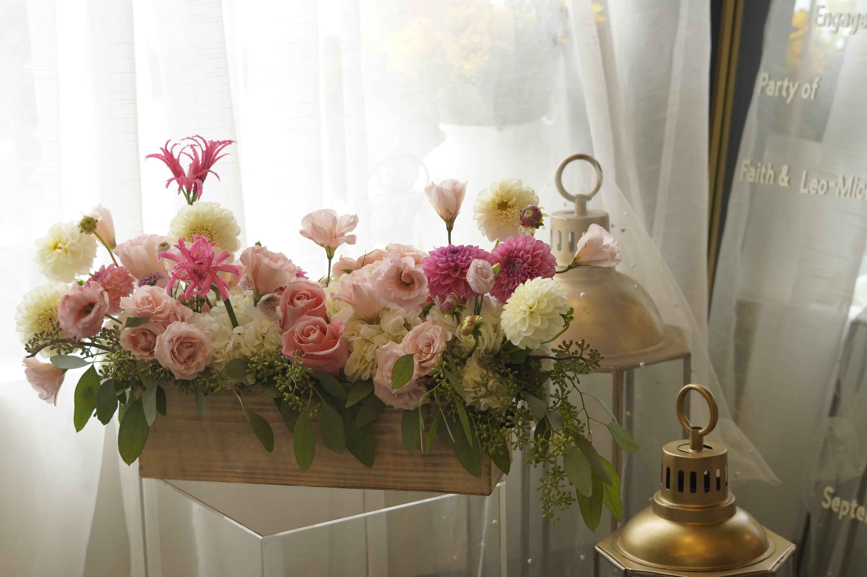 Luxury blush garden flowers arranged in a rustic wooden box