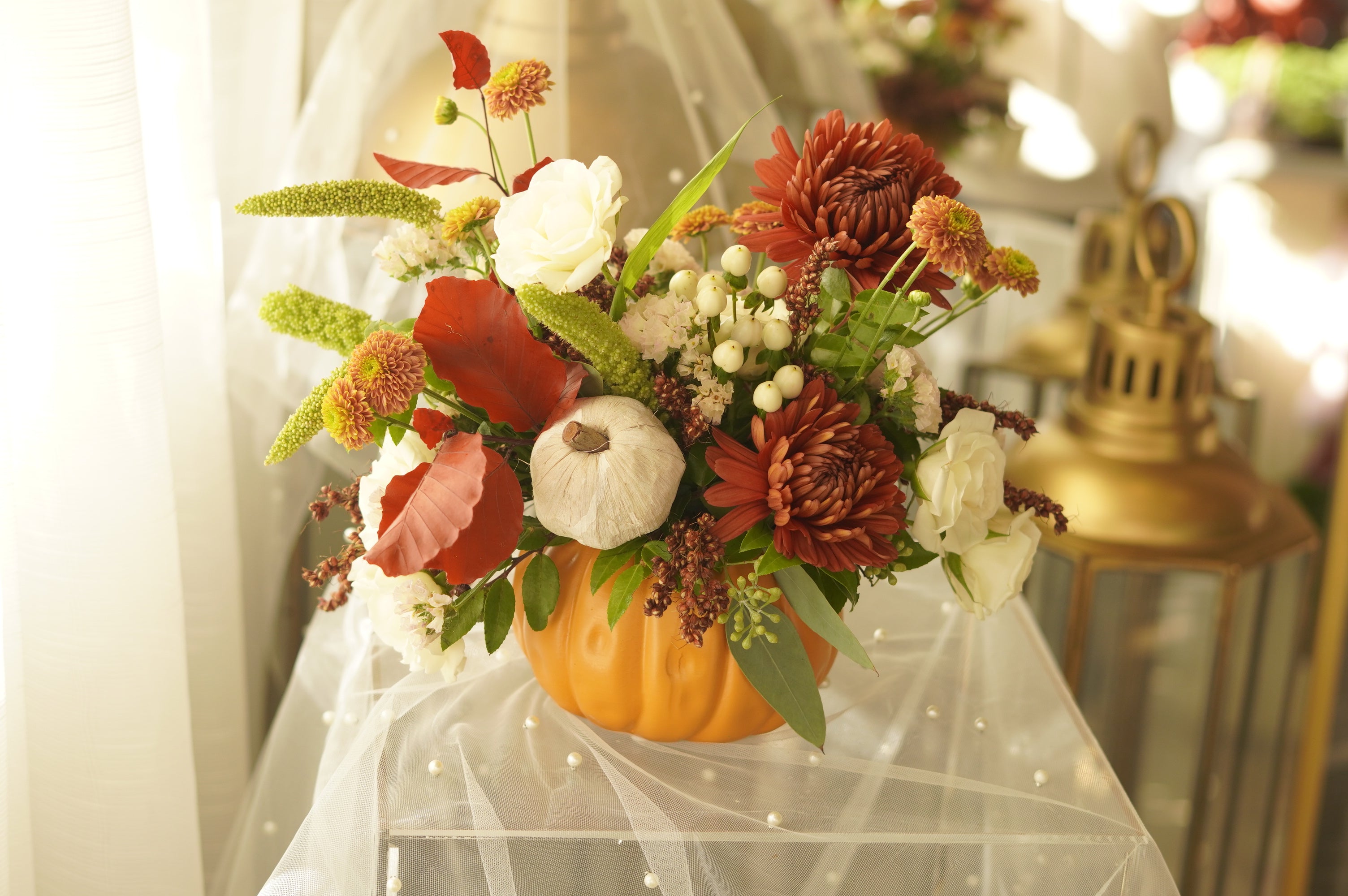 Golden Harvest arrangement in a real pumpkin — autumn flower delivery Toronto