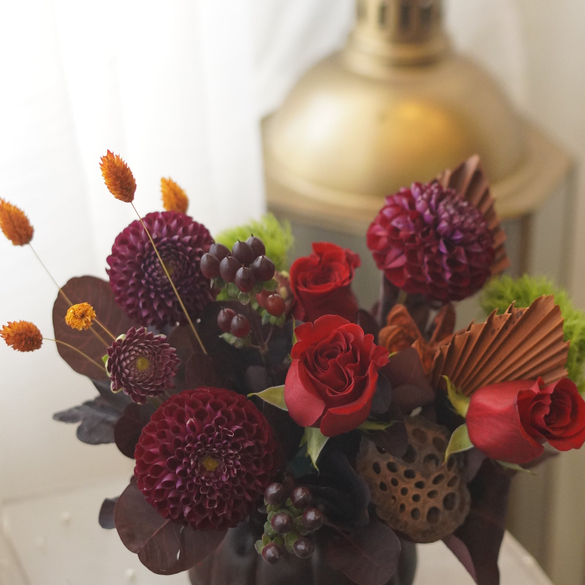 Crimson Harvest in a dark pumpkin-shaped vase — Toronto flower delivery