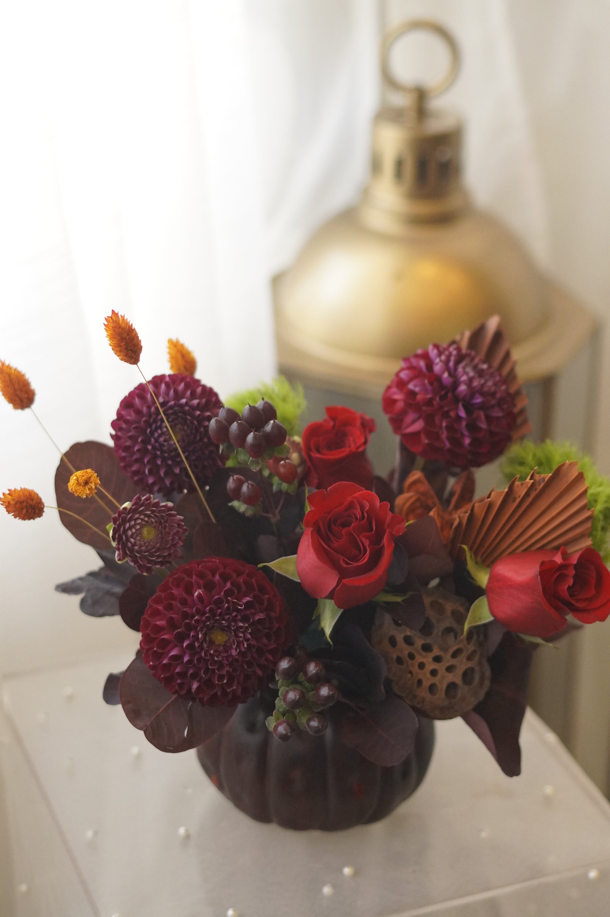 Crimson Harvest in a dark pumpkin-shaped vase — Toronto flower delivery