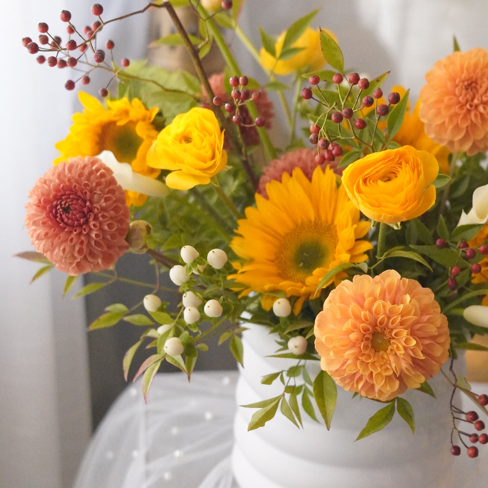 Sunflowers, peach dahlias, and yellow ranunculus — Toronto and Oakville autumn flowers