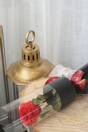 Close-up of single red preserved rose laid flat, classic red preserved rose for Valentine’s Day