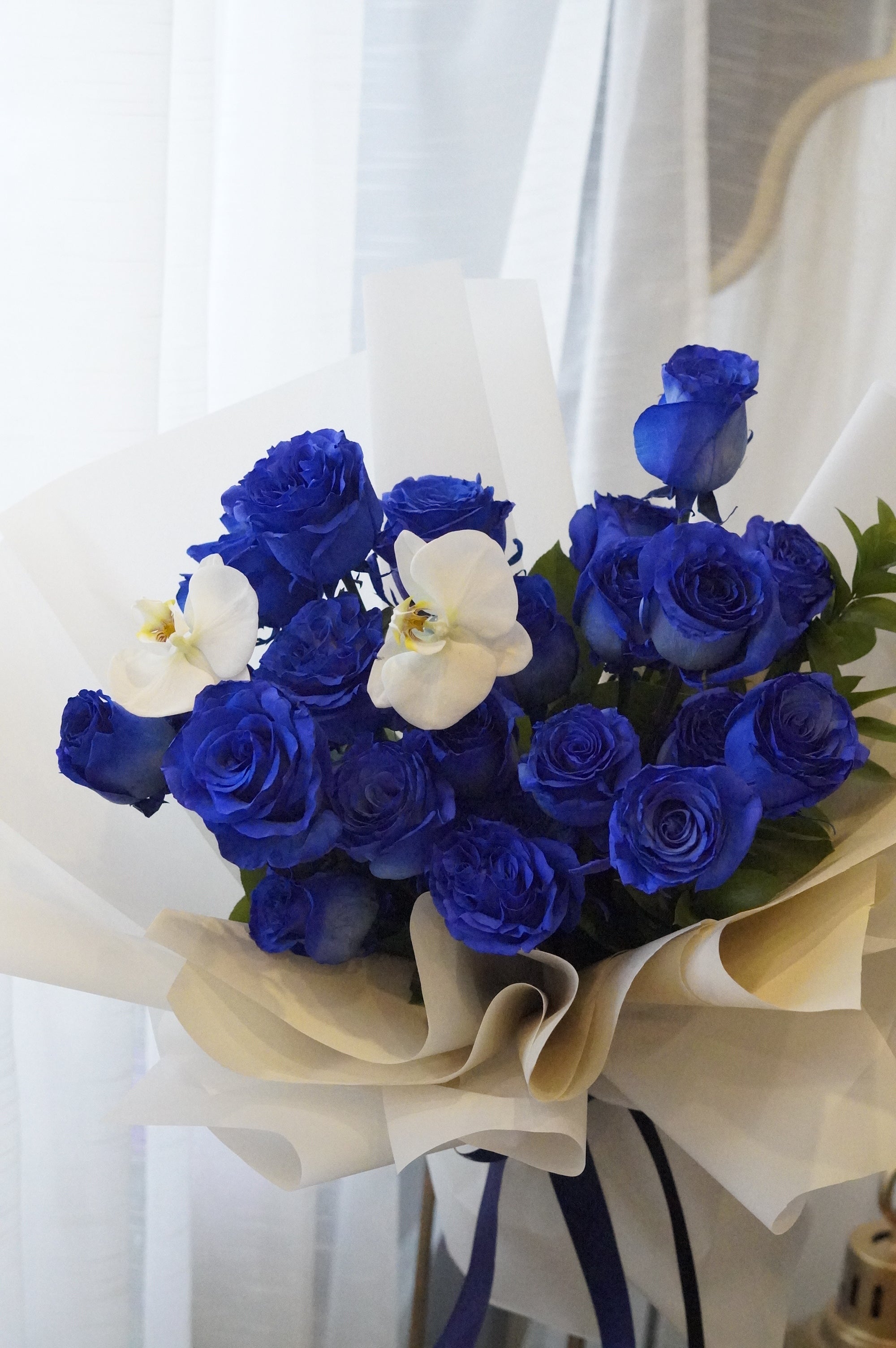 Elegant wrapped blue rose bouquet for birthday, anniversary or special occasion