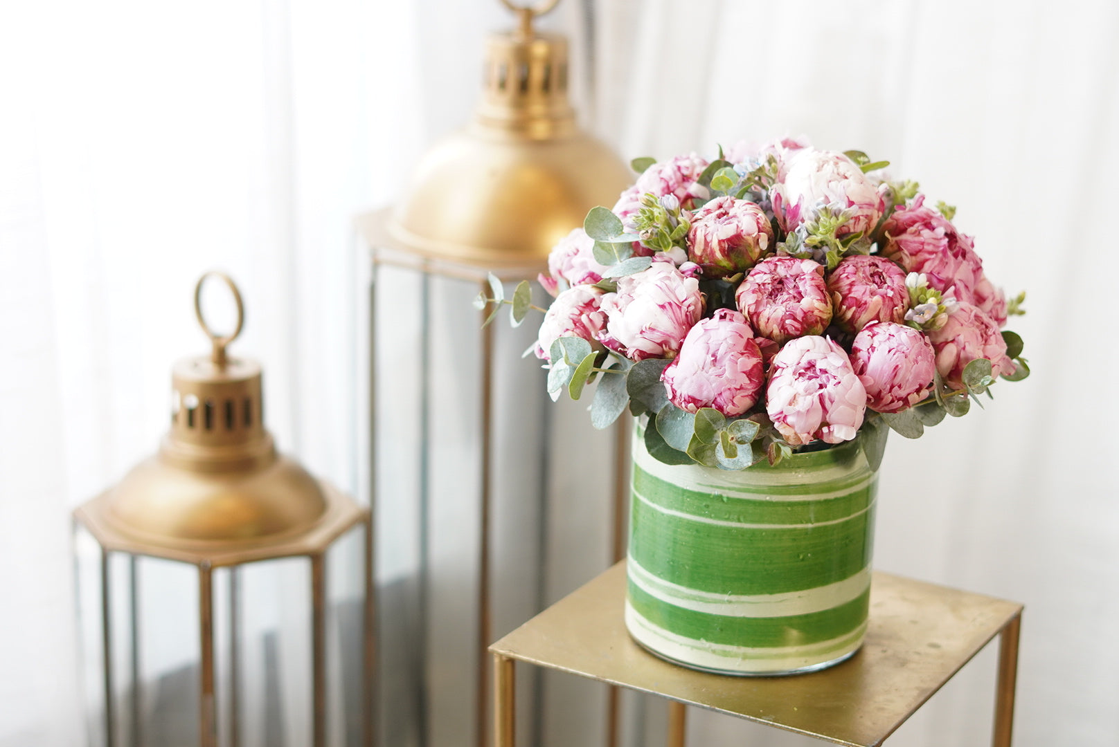 Exquisite  peony arrangement of plump, layered floral blossoms in soft sorbet tones,with eucalyptus by Moon's flowers delivery Toronto