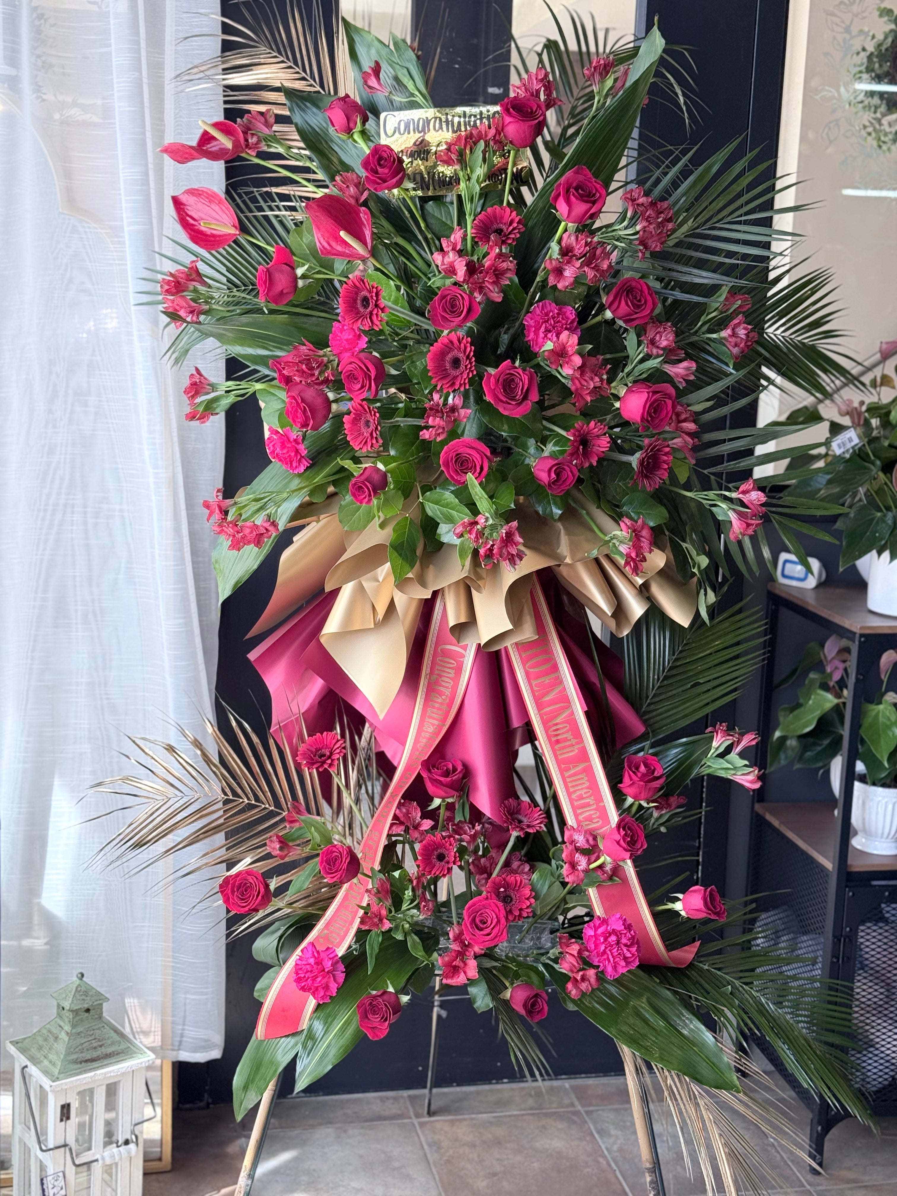 Grand opening flower stand with red roses by Moon’s Flowers Toronto