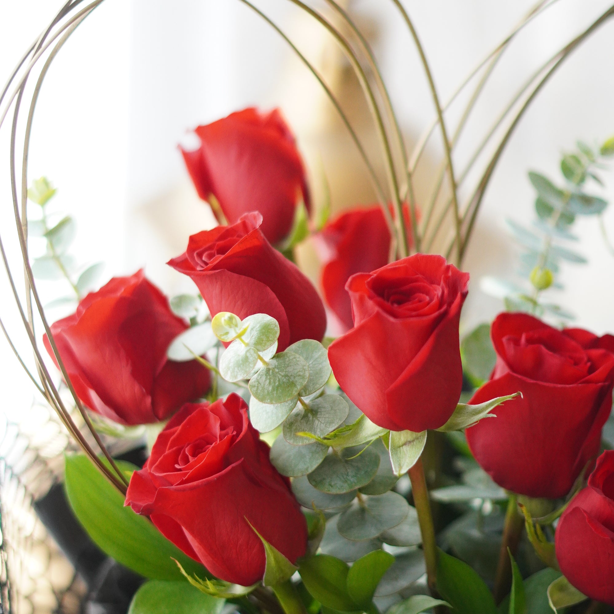 Close-up of heart-shaped red roses showing petal detail and structured design