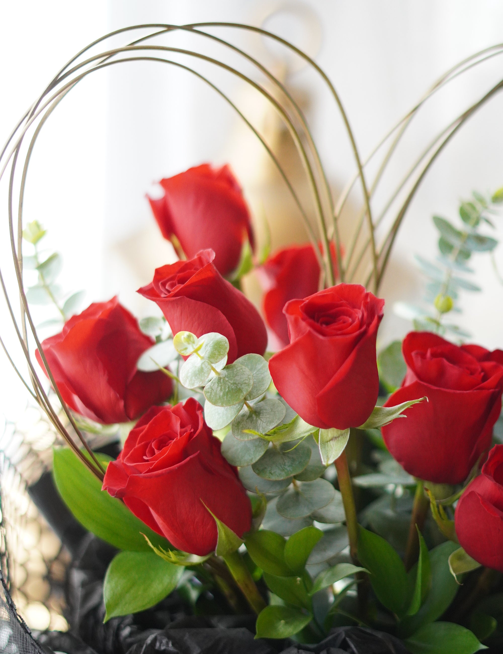 Close-up of heart-shaped red roses showing petal detail and structured design