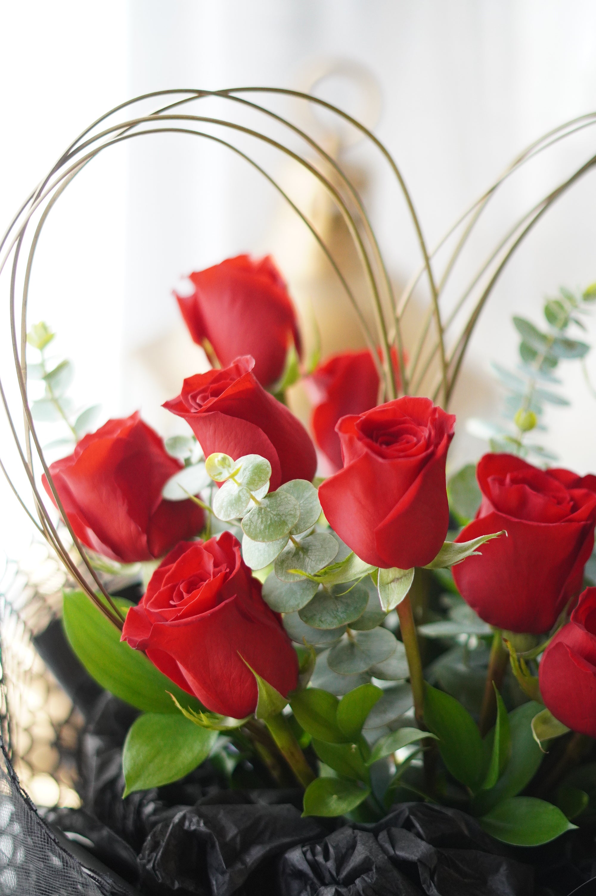 Close-up of heart-shaped red roses showing petal detail and structured design