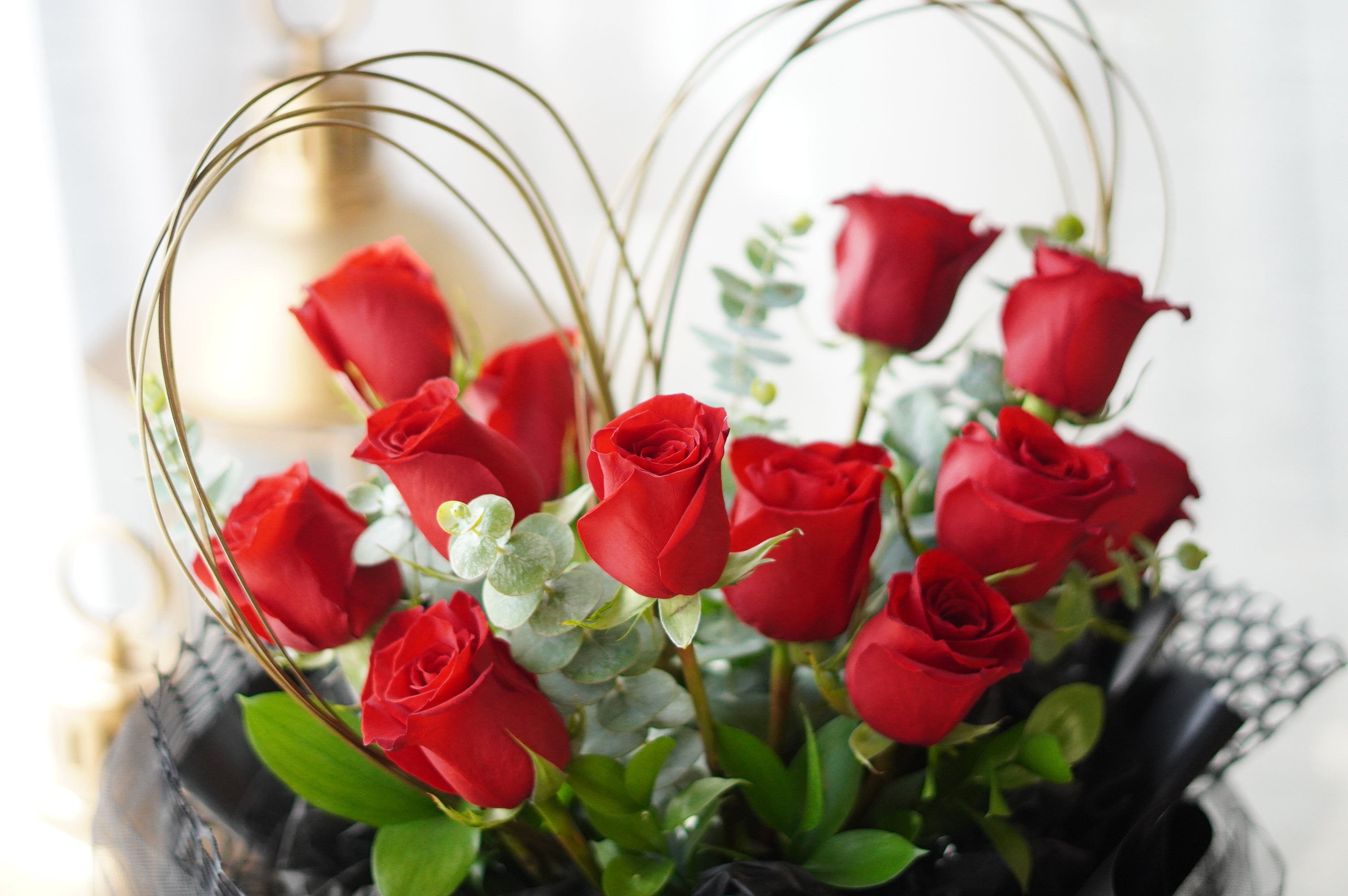 Heart-shaped rose bouquet featuring a clean and balanced floral arrangement