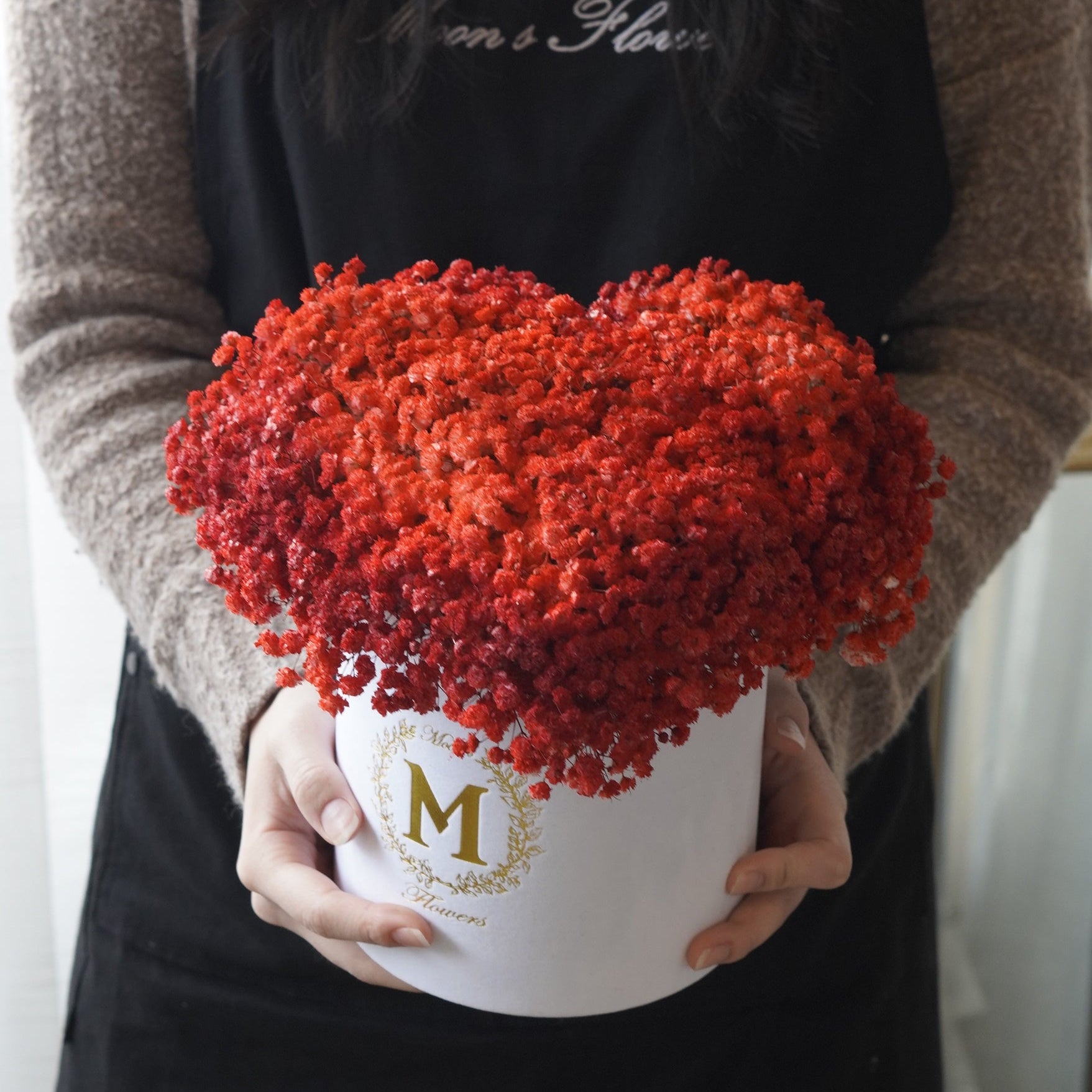 A vibrant red baby's breath floral arrangement in a premium gift box , perfect for a unique Mother's Day gift.