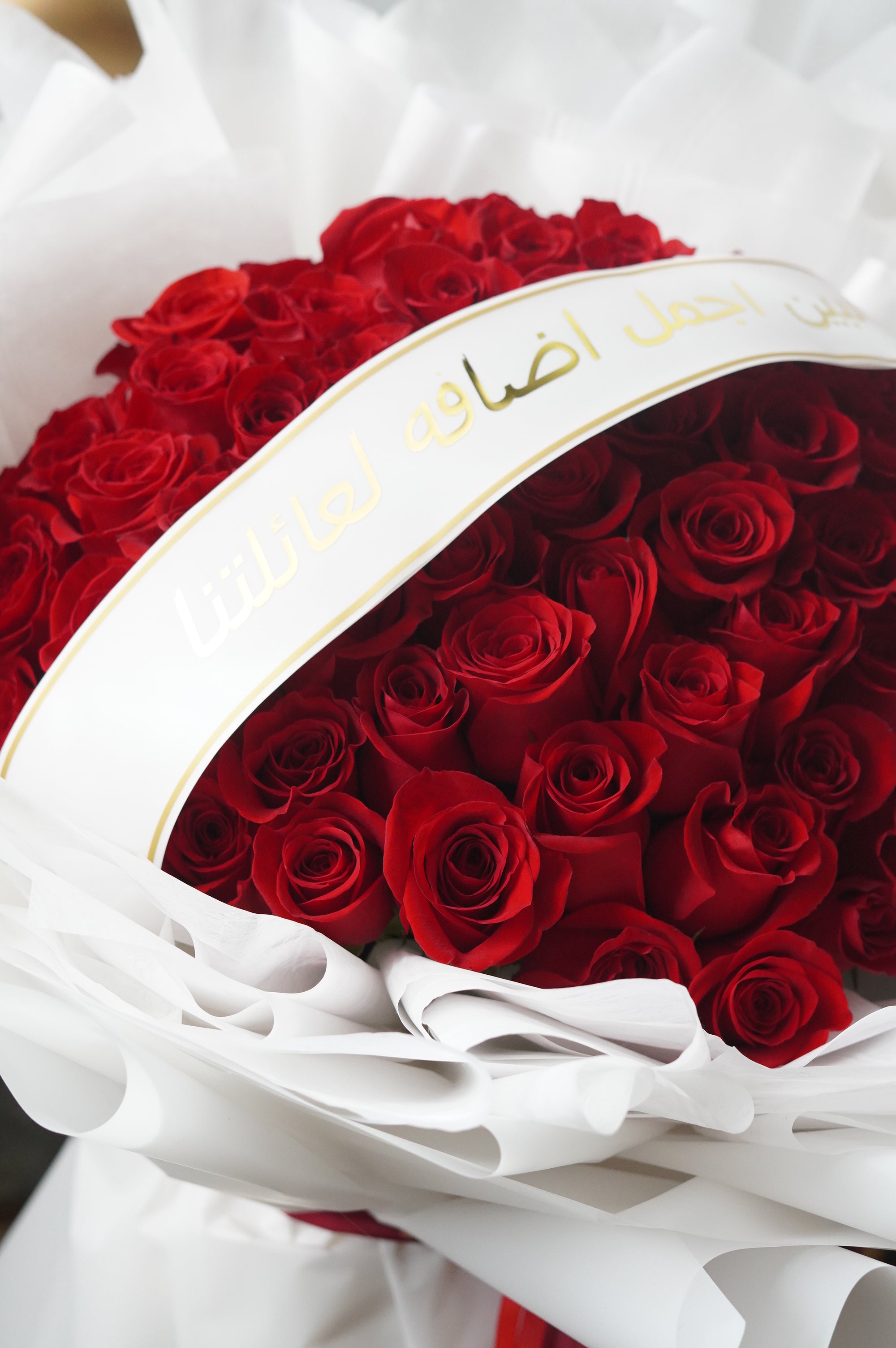 100 red rose round bouquet with custom lettering message for a proposal or special occasion