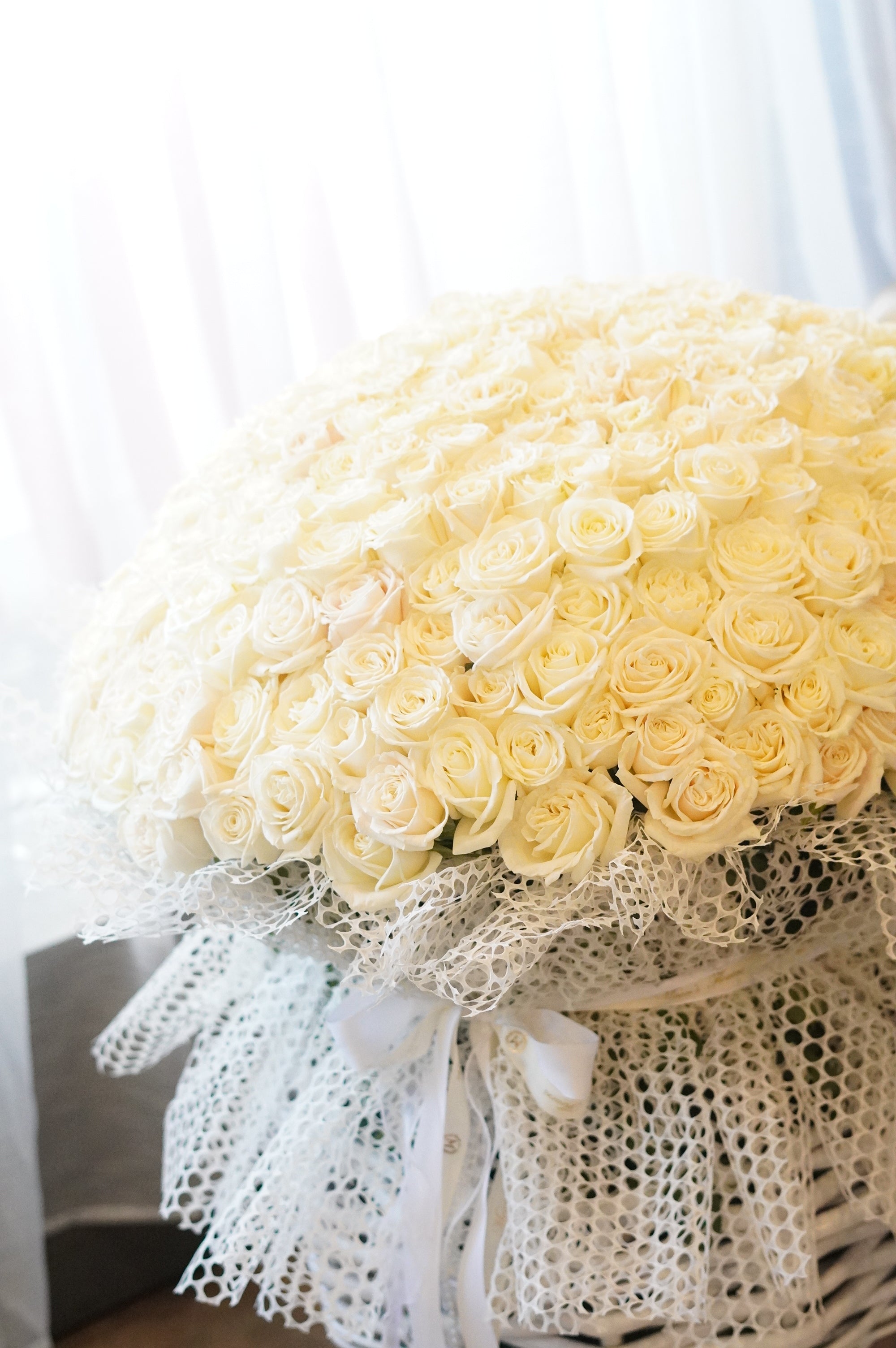 100 white roses round bouquet made with premium Playa Blanca roses